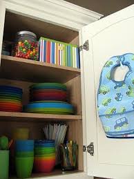 Great Way To Organize The Kid S Kitchen Cabinet I Did This In My Kitchen And It Makes A Huge Difference Kids Cabinet Baby Organization Organization Kids