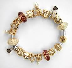 Click & collect now available in selected stores. Gold Pandora Bracelet With White And Brown Accents Pandora Bracelet Designs Pandora Jewelry Necklace Pandora Bracelet Charms