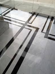 Strikingly Contrasting Marble Creates A Floor Pattern That S Not The Typical Boarder And Works Well With The A Art Deco Kitchen Art Deco Interior Marble Design