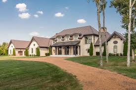 But black trim, windows, and doors give the home a crisp, modern edge. Tour This Gorgeous French Country House In The Tennessee Countryside