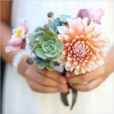 They're the perfect choice for brides who want something a little different than the standard rose, tulip, and peony arrangement. Small Succulent Dahlia Bouquet Succulent Bouquet Wedding Dahlias Wedding Wedding Flower Inspiration