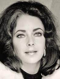 ✈️ Airport style: Elizabeth, elegantly dressed for winter in New York, is  photographed at John F. Kennedy International Airport in February 1974.