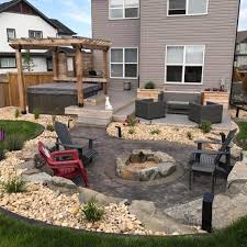 They are a great way to create really social and warm atmosphere in your yard, which is perfect for entertaining or spending time with the family. Stamped Concrete Fire Pit Walkway Edmonton Concrete Ltd