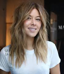 This lob is cut bluntly on the ends with some classic layers, looking soft and informal with soft beach waves and a marvelous blonde ombre color. 23 Gorgeous Medium Wavy Hairstyles Stylesrant