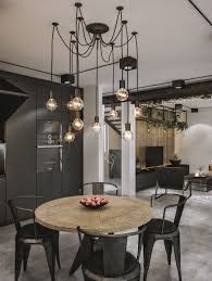 Black Becomes The Color Of Choice Inside The Industrial Kitchen And Dining Area Loft Interior Design Modern Interior Decor Urban Industrial Decor