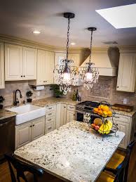 French Kitchen Farmhouse Sink Cream Cabinets Mini Chandelier Cream Granite Center Island Tumbled Marbl Farmhouse Sink Kitchen Cream Cabinets Kitchen Marble