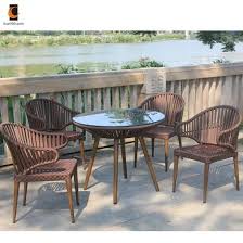 These can look sophisticated in black or earth tones, surrounding a matching table. Outdoor Restaurant Table Chairs Outdoor Restaurant Garden Patio Furniture Outdoor Table