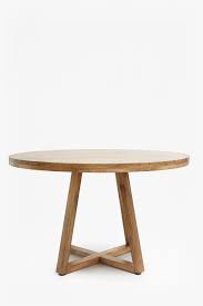 Similar to round tables, an oval shape dining table is ideal for occasional seating. Round Wooden Dining Table Collection French Connection