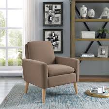 This Armchair Showcases A Scrolling Botanical Motif For A Pop Of Pattern This Low Profi Arm Chairs Living Room Living Room Chairs Modern Furniture Living Room