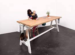 Pit itself has wire rack holding burning wood off bottom. The Cooking Table Studio Moritz Putzier