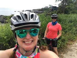 Cancer tries, but we TRI harder! MMC Cancer Institute staff Magda Alden  (below) and Katherine Lafferty and Stephanie Hood bike in this year's  virtual Maine Cancer Foundation's Tri for a Cure -