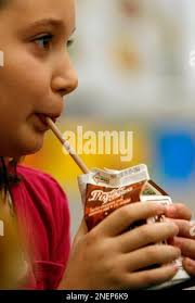 In this Nov. 6, 2009 photo, Haley Morris, 5th grade, drinks a chocolate  milk during her lunch break at the Roslyn Road Elementary School in  Barrington, Ill. A new campaign by the