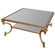 The top of the coffee table is fitted with a round glass surface which provides a modern touch to the piece. Lot Art Vintage Neoclassical Style Glass Top Coffee Table