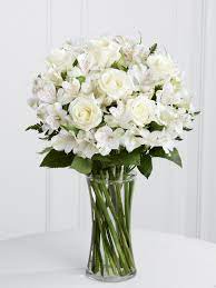 Vased White Alstroemeria And Standard Roses Alstroemeria Bridal Bouquet Purvian Lilies Are Available In Pin Funeral Flowers Flower Arrangements White Roses