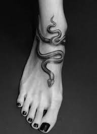 9 Simple And Traditional Snake Tattoo Designs With Meanings Snake Tattoo Ideas Snake Tattoo Design Snake Tattoo Designs