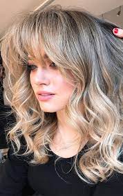The entire hair is messy and casually parted to a side. Trendy Hairstyles Haircuts With Bangs Medium Length Wavy With Bangs