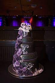 We Are Obsessed With This Edgy Skull Rocker Wedding Cake This Black And Purple Cake Topped W Gothic Wedding Cake Halloween Wedding Cakes Skull Wedding Cakes