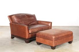 Target / furniture / oversized chair and ottoman (3326). Lot An Oversized Leather Upholstered Theater Seat And Ottoman Modern