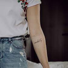 70 Tattoos That Prove How Powerful A Single Word Can Be Serendipity Tattoo Tattoos Elbow Tattoos