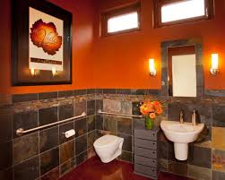 Modern Orange Bathroom With Dark Marble Half Wall And Floating Sink And Toilet Orange Bathrooms Orange Bathroom Walls Bathroom Design