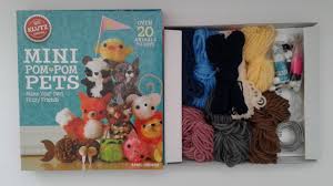 Now you can turn plain yarn into perfectly precious pups. New Klutz Pom Pom Pets Craft Kit