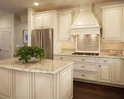 Cabinet Refacing Creates A Traditional Masterpiece Complete With Vintage Styled Doors In An Beige Kitchen Antique White Kitchen Antique White Kitchen Cabinets