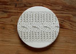 Stop before the end of a row and turn work to other side. Cable Knit Round Coasters