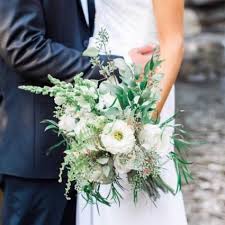 With the right hand, add between four and six clusters of foliage evenly around and just below the flower heads to fill the spaces between them. Hand Tied Wedding Bouquet Pasteurinstituteindia Com