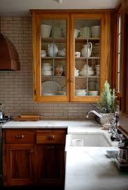 There's something so classic about a darker kitchen and the use of wooden cabinets. Best Countertop For Stained Wood Cabinets Maria Killam