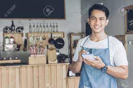 Fiszkoteka, your checked english malaysian dictionary! Happy Asian Male Waiter In Apron Writing Order And Looking At Stock Photo Picture And Royalty Free Image Image 55560095