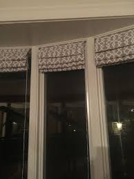 In summary, dressing a bow or bay window isn't that much different than dressing a regular window with the exception of size and shape. Long Narrow Roman Shades For Bow Window Bow Window Window Curtains Living Room Narrow Windows