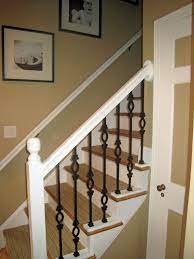 Available in many color choices. White Railing With Iron Spindles Wrought Iron Banister Banister Remodel Banisters