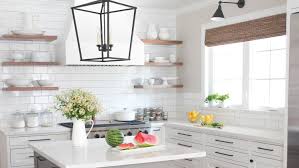If your base cabinets are regular 34 and a half inches, then simply place your upper cabinets 18 inches above them, and you should be good to go. Gorgeous Modern Farmhouse Kitchens
