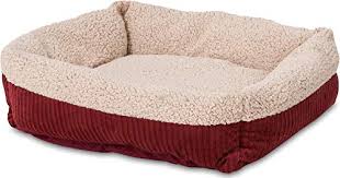 The bed features a round design, creating a cozy and protective atmosphere. The Best Cat Beds On Amazon To Keep Kitty Cozy
