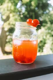 This easy to make layered drink is a sweet blend of coconut rum, pineapple, and grenadine. Easy Summer Cocktails Malibu Sunset Cocktail Recipe Greta Hollar