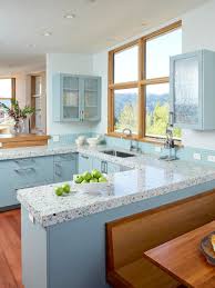 Matching the countertops to a paint color can be gorgeous, but keep in mind that your color tastes veined or speckled countertop patterns can give you the pops of color you need, without creating. Blue Kitchen With Speckled Countertop And Wood Frame Window Hgtv