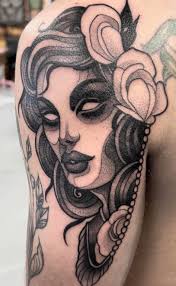 Female tattoo artist specializing in linework