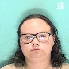 A woman has posted bail after being accused of binding a 1-year-old's arms  and legs with tape and leaving the child unattended