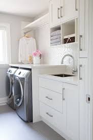 Small Laundry Room Glass Mosaic Backsplash White Cabinets Grey Floor Tiles Barlow Reid Laundry Room Inspiration Laundry Room Remodel Mudroom Laundry Room