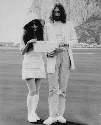 John Lennon And Yoko Ono Holding Marriage Certificate Iconic Weddings Celebrity Wedding Dresses John Lennon And Yoko