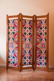 This carved mango wood divider is 6 feet tall, 60 inches long, and outfitted with three panels. Reserved For Bradysheena Folding Screen Room Divider Made From Wood And Vlisco Fabric Biombo De Madera Y Tela Africana Folding Screen Room Divider Sliding Room Dividers Bamboo Room Divider