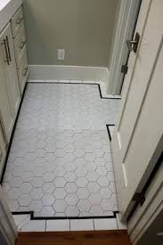 Hall Bath Floor With Large White Hex Tile And Black Pencil Tile Border Tile Bathroom Black Floor Tiles White Tile Floor