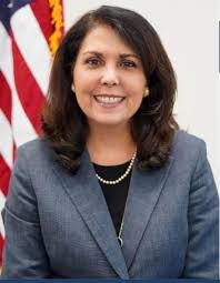 Retired Maj. Gen. James Williams (right) salutes as Staff Sgt. Aaron  Garretson, of Company A, 1st Battalion, 148th Infantry Regiment, 37th  Infantry Brigade Combat Team, presents the folded American flag during a
