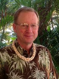 B & B owner, John Gamble, shares one of his favorite Niihau Shell lei, at  The Palms Cliff House Inn.