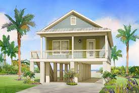 See amazing and beautiful stilt homes—you'll want to climb up and go in! The Perfect Beach Home By Affinity Building Systems Llc The Fish Hawke Is Perfect For Your Next B Beach Cottage House Plans Stilt House Plans House On Stilts