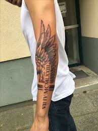 Angel wing tattoos 125 angel wing tattoos that are heavenly intended for measurements 800 x 1067 angel wings tattoo on arm the tattoos can be perceived as an indication of toughness, strength, and a small bit of softness. Roman Numerals Arm Tattoo Fallen Angel Tattoo Angel Wing Man With White Top Jeans Cool Forearm Tattoos Arm Tattoos For Guys Angel Wings Tattoo