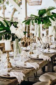 20 Beach Wedding Centerpieces For A Tropical Or Nautical Theme Beach Wedding Centerpieces Beach Wedding Tables Beach Theme Wedding