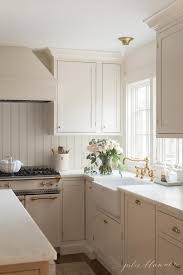 I think kitchen cabinets are the toughest paint color decision that we'll make (it's agonizing really). Cream Kitchen Cabinet Custom Paint Color Julie Blanner