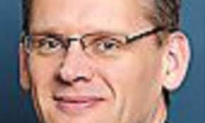 IN THE MONEY: John Pettigrew, 49, CEO of National Grid saw his pay decrease  to £3.5m