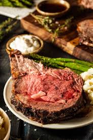 Place the rib roast in a large roasting pan, bone side down, and spread the mustard/herb rub thickly all over the surface. The Best Prime Rib With Garlic Peppercorn Wet Rub